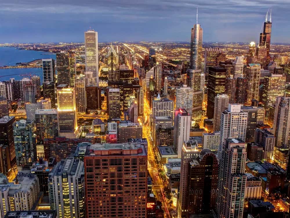 Chicago at dusk, seen from the John Hancock Center, with Lake Michigan on the left.