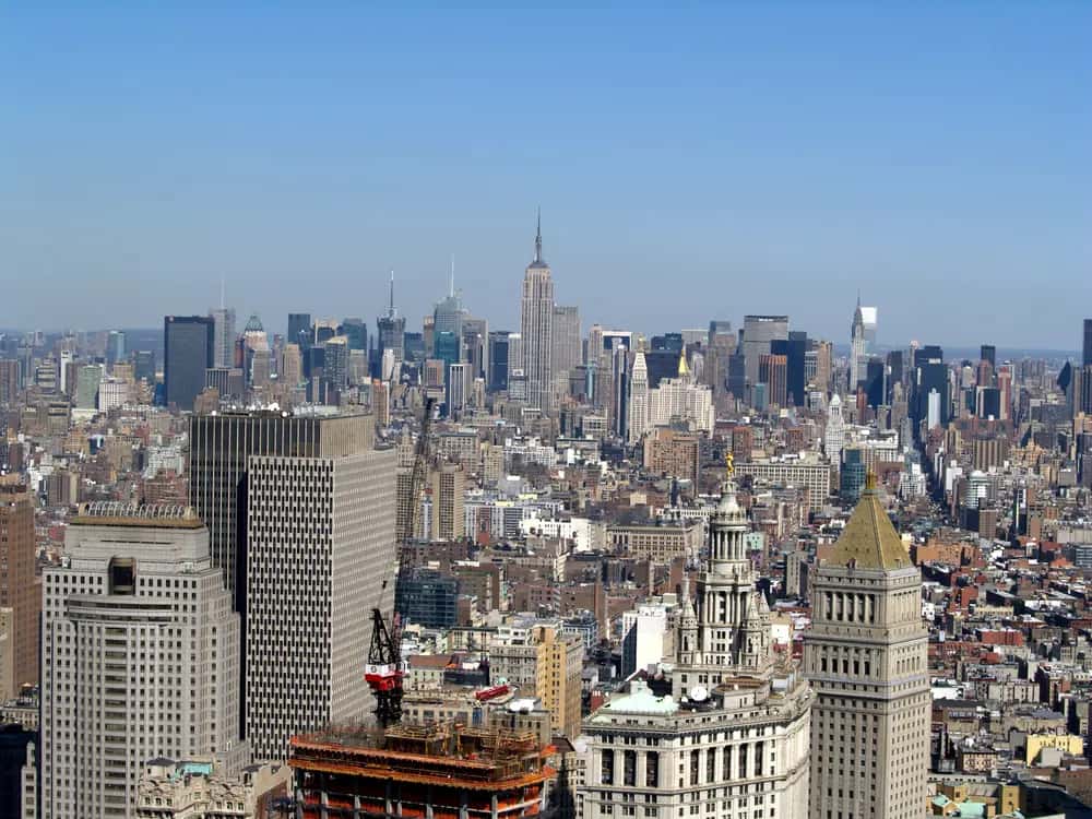 Midtown Manhattan skyline with the Empire State Building, seen from Wall Street.