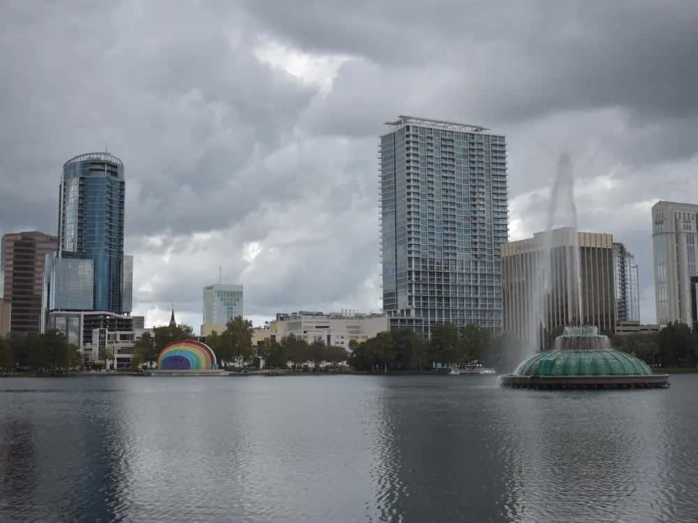 Lake Eola and its fountain in front of the downtown Orlando skyline.